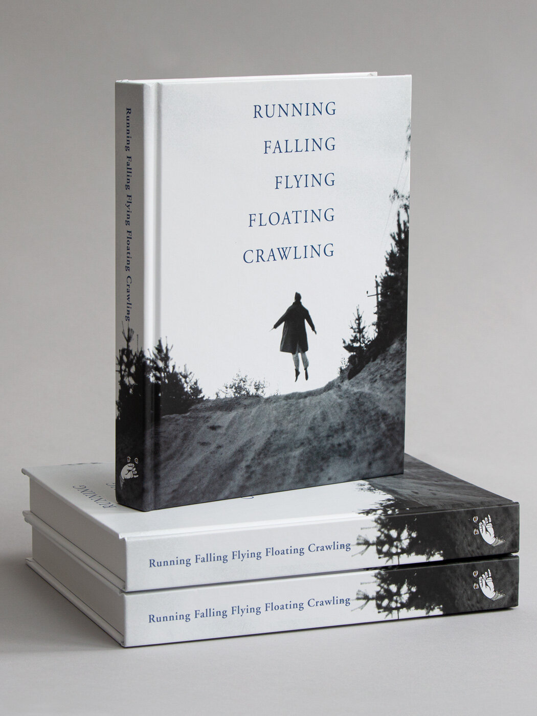 short stack of Running, Falling, Flying, Floating, Crawling books
